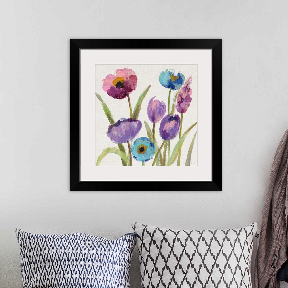 A bohemian room featuring Square watercolor painting of purple, blue, and pink flowers on a white background.