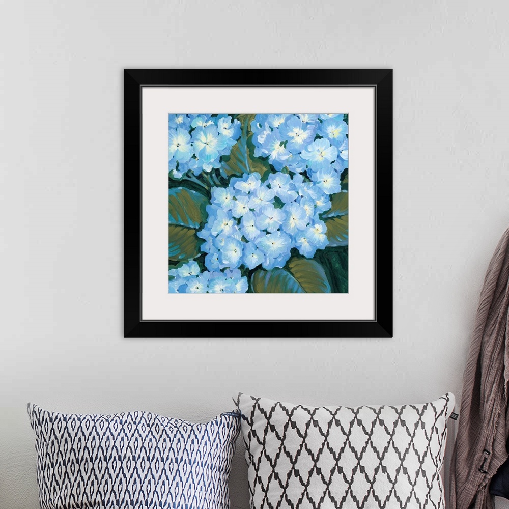 A bohemian room featuring Painting of blue hydrangea flowers close-up.