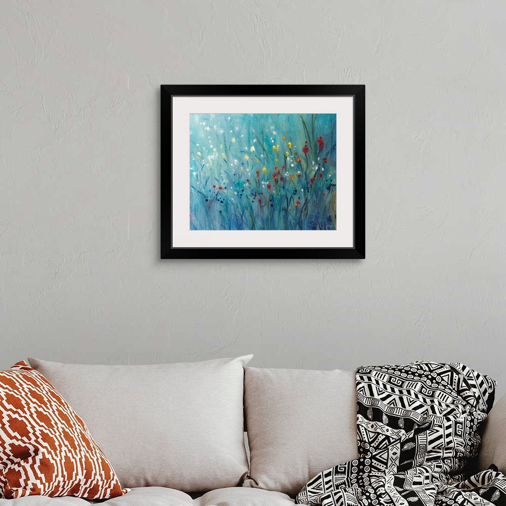 A bohemian room featuring Contemporary painting of small, brightly colored wildflowers contrasted against dark grass.