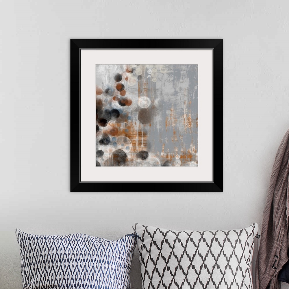 A bohemian room featuring Abstract artwork of washed out colors and circle shapes.