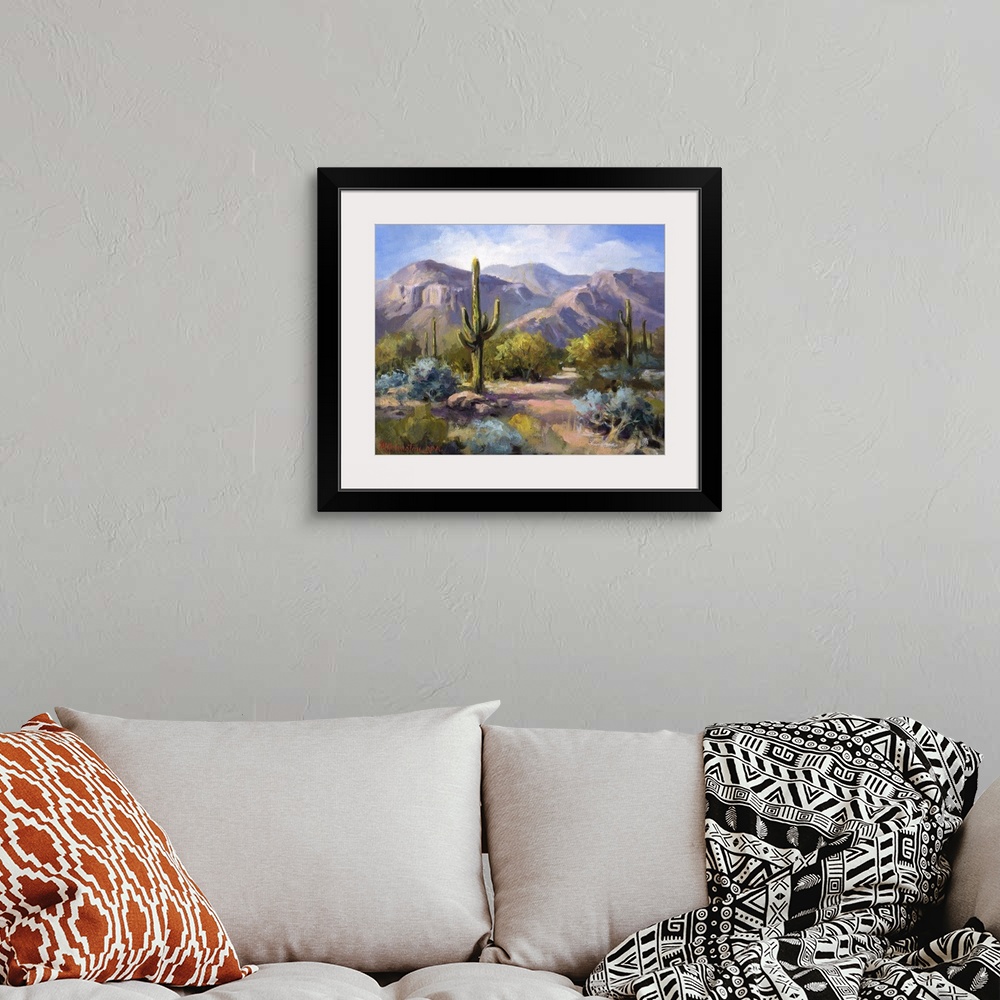 A bohemian room featuring Contemporary landscape painting of the southwest.