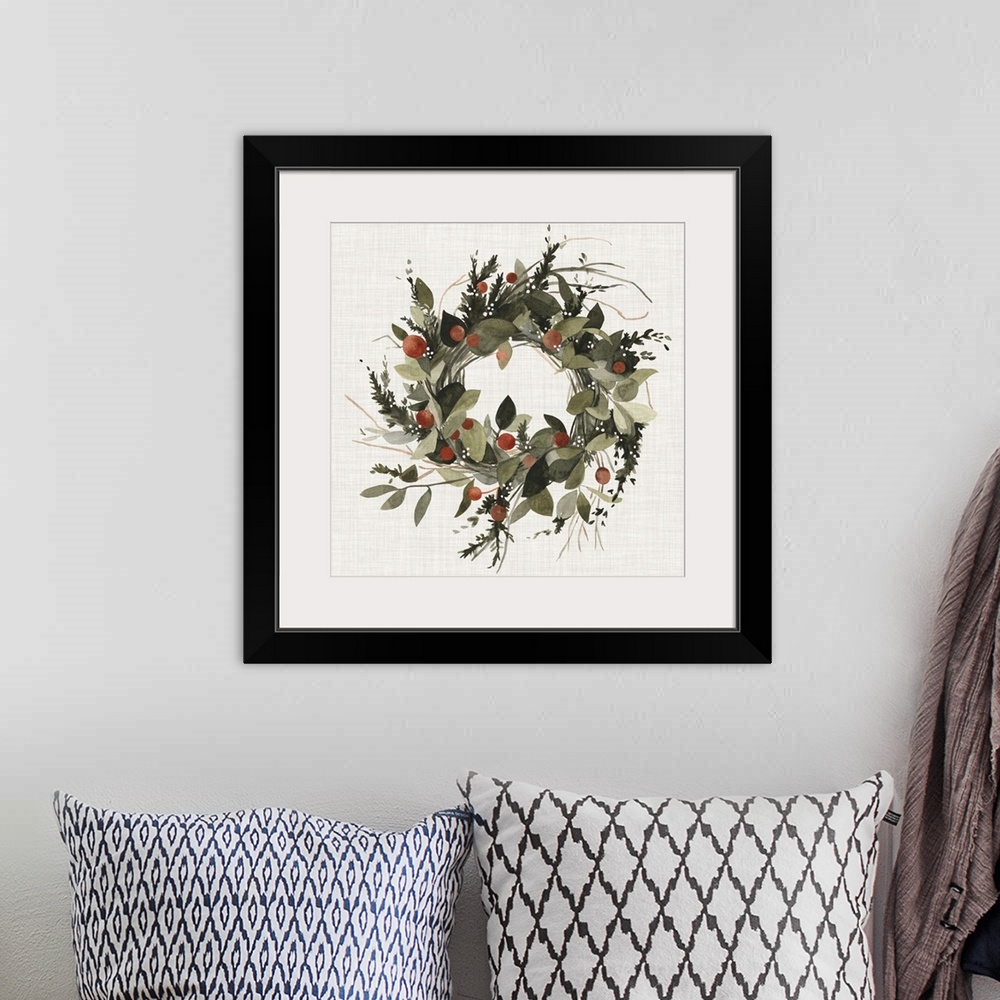 A bohemian room featuring A decorative farmhouse wreath of holiday greenery and berries on a linen background.