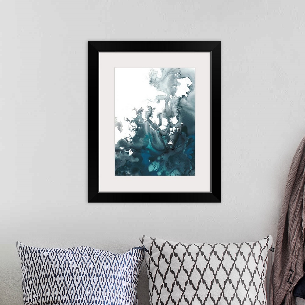 A bohemian room featuring Abstract artwork with indigo hues marbling together creating movement on a white background.
