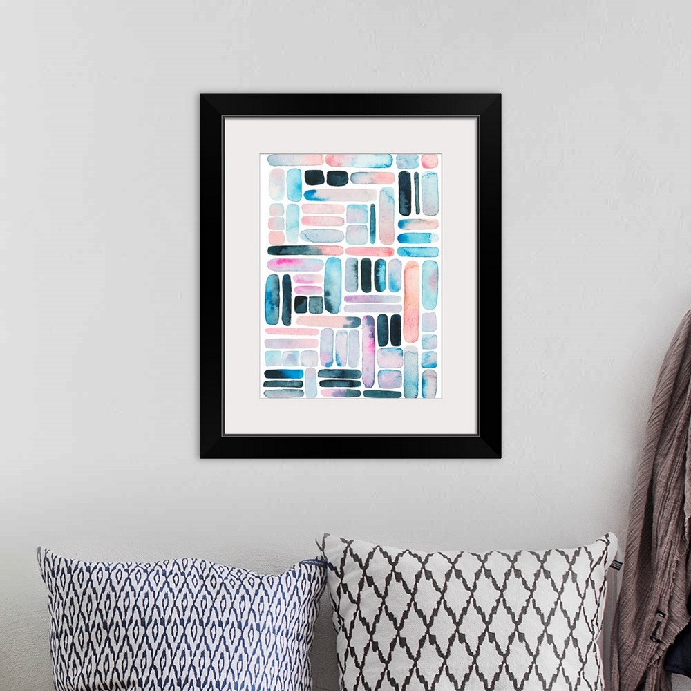 A bohemian room featuring Vertical watercolor painting of varies rounded square and rectangle shapes in a grid design.