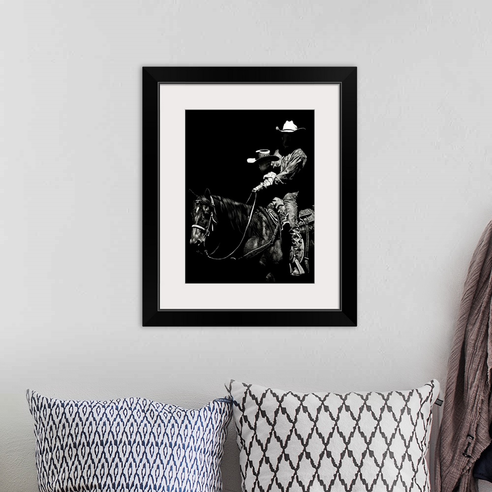 A bohemian room featuring Black and white lifelike illustration of a cowboy and child riding a horse.
