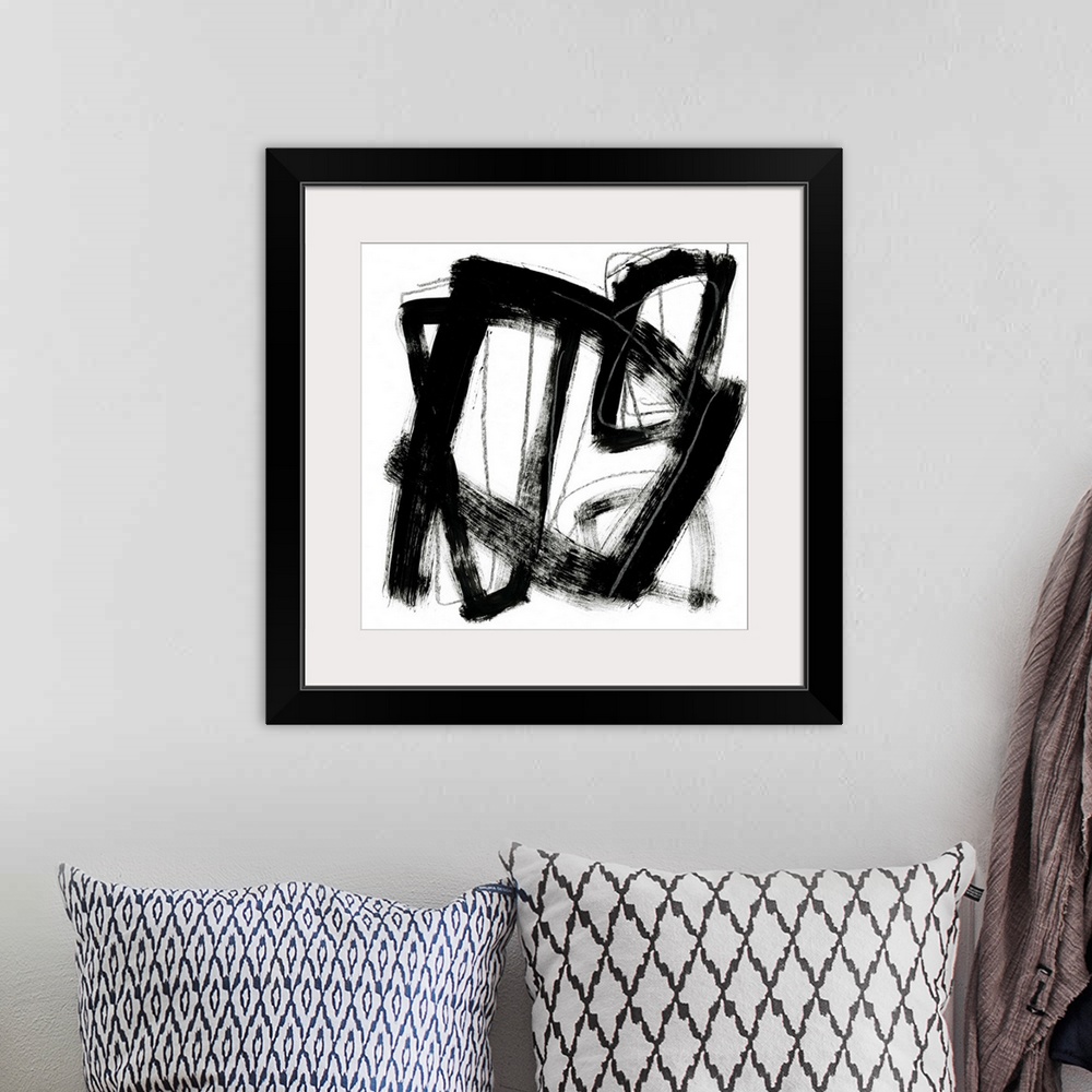 A bohemian room featuring Contemporary abstract painting using bold black contrasting against a stark white background.