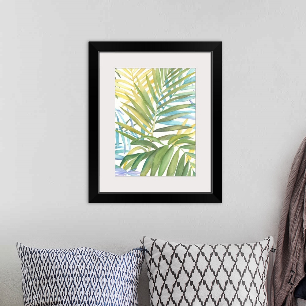 A bohemian room featuring Watercolor painting of several tropical leaves.