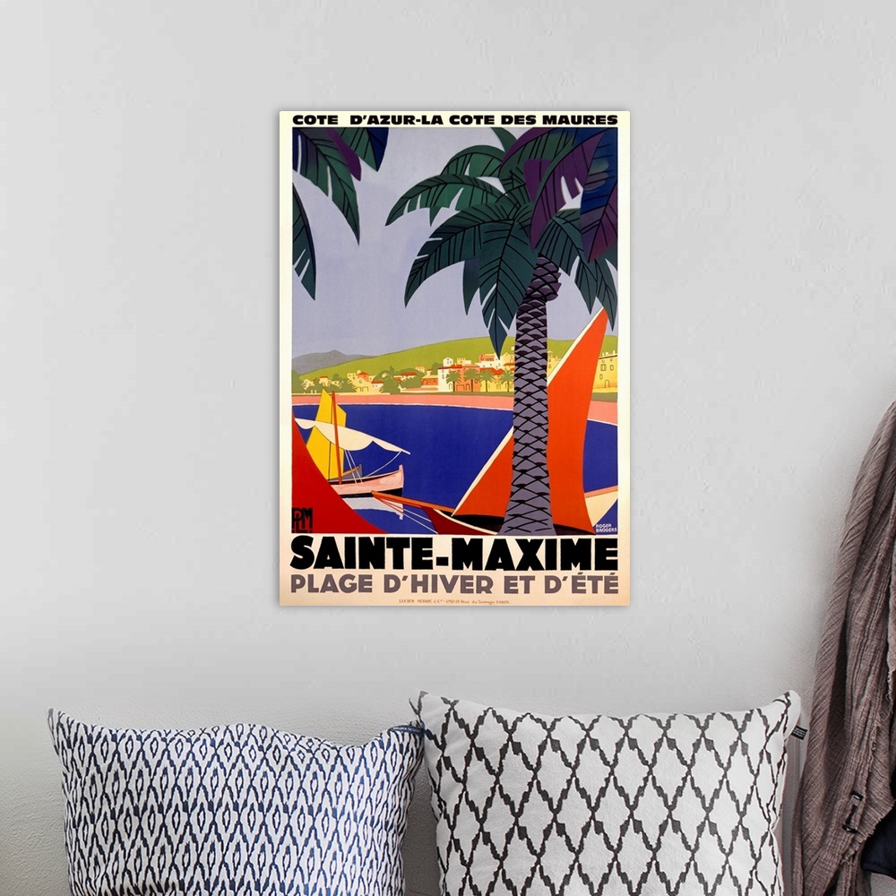 A bohemian room featuring Vertical, large vintage advertisement for Sainte-Maxime, France.  Palm trees over a body of water...