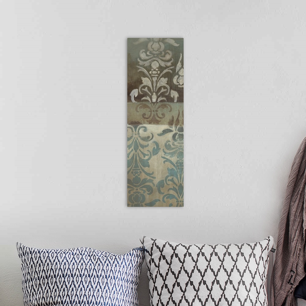 A bohemian room featuring A long vertical painting of damask inspired patterns in muted shades.