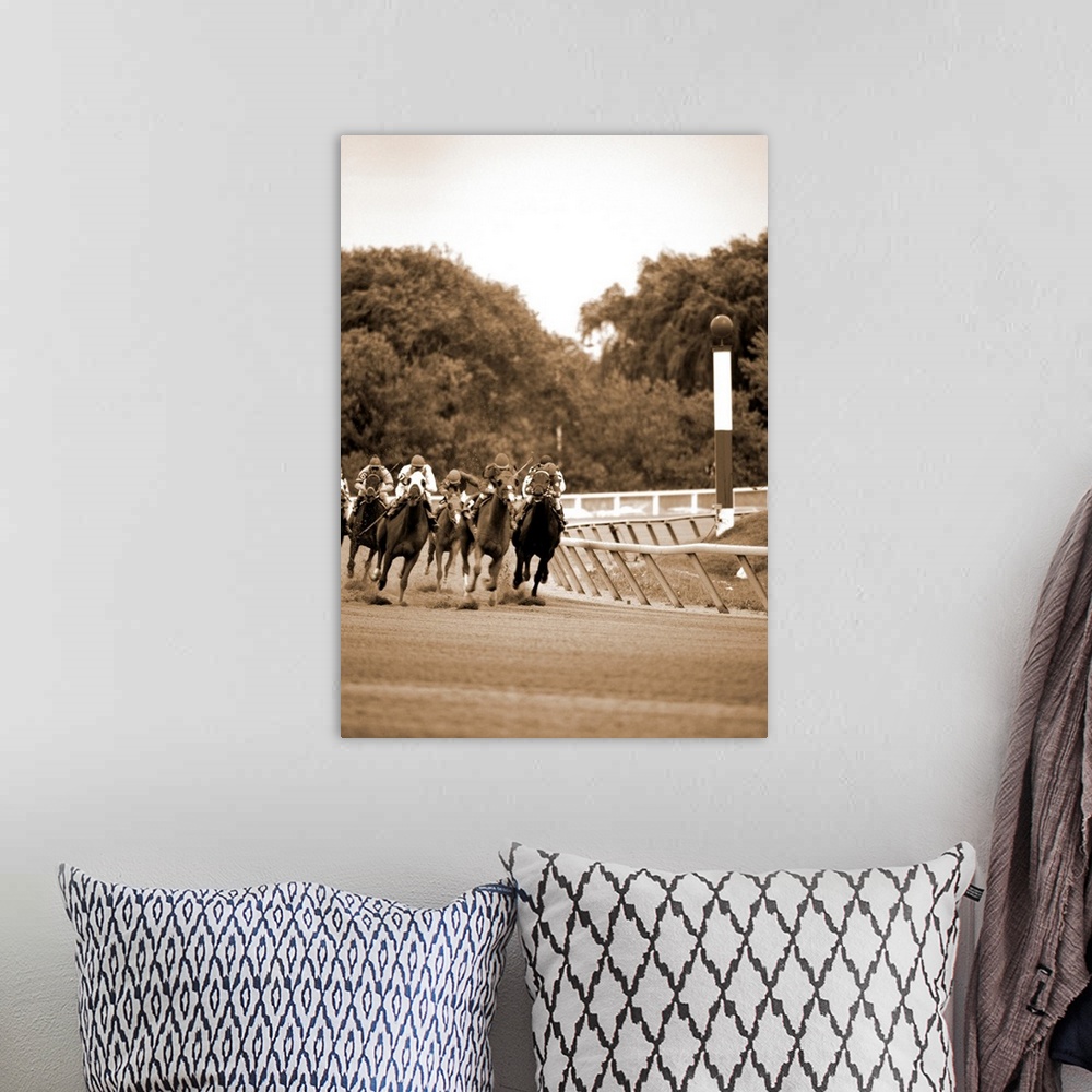 A bohemian room featuring Arlington Park Group of thoroughbred horses comming out of the turn.