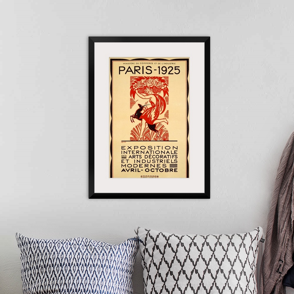 A bohemian room featuring Antique art work of advertising piece showcasing an event in Paris, France.  The poster features ...