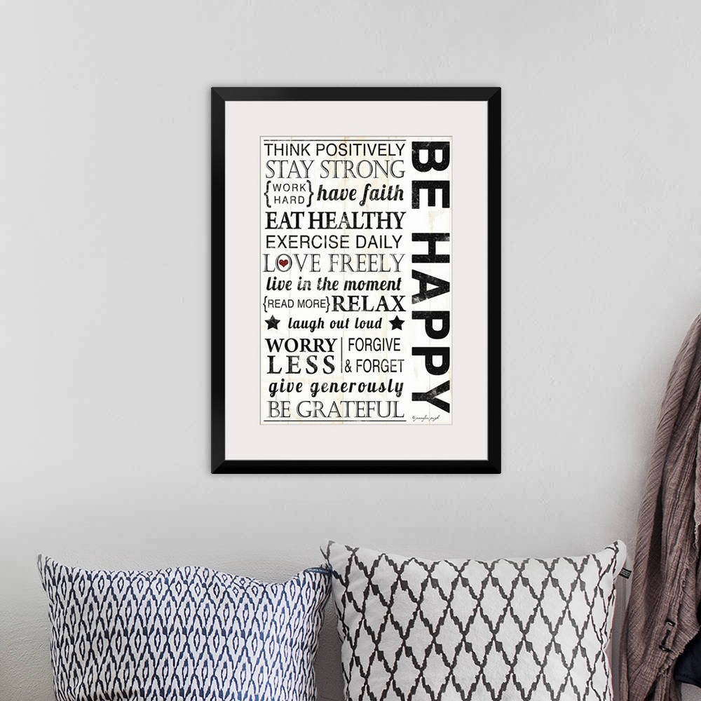 A bohemian room featuring Large inspirational art composed of motivational text filling the entire area that tells somebody...