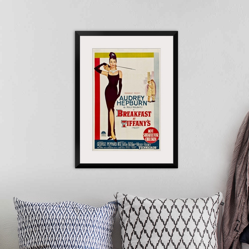 A bohemian room featuring Vertical, large vintage advertisement for the movie "Breakfast At Tiffany's", with actress Audrey...