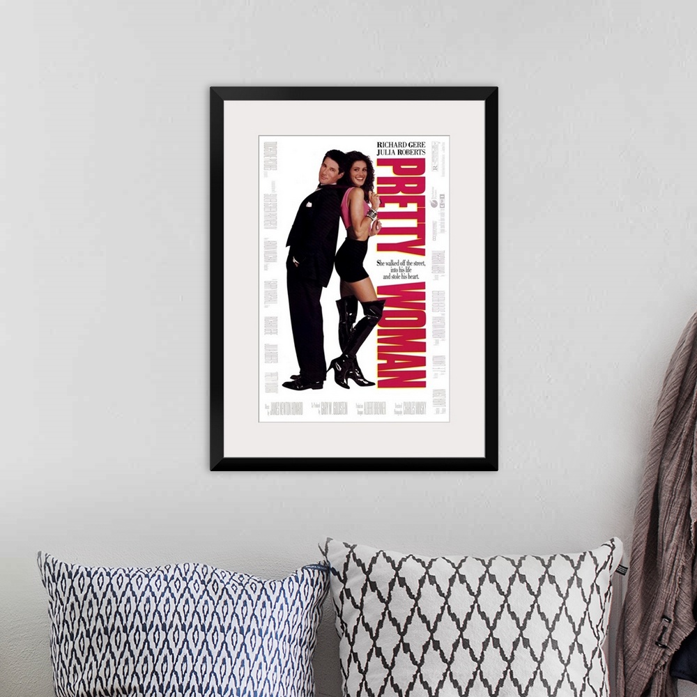 A bohemian room featuring Vertical, large movie advertisement for "Pretty Woman", with Julia Roberts and Richard Gere stand...