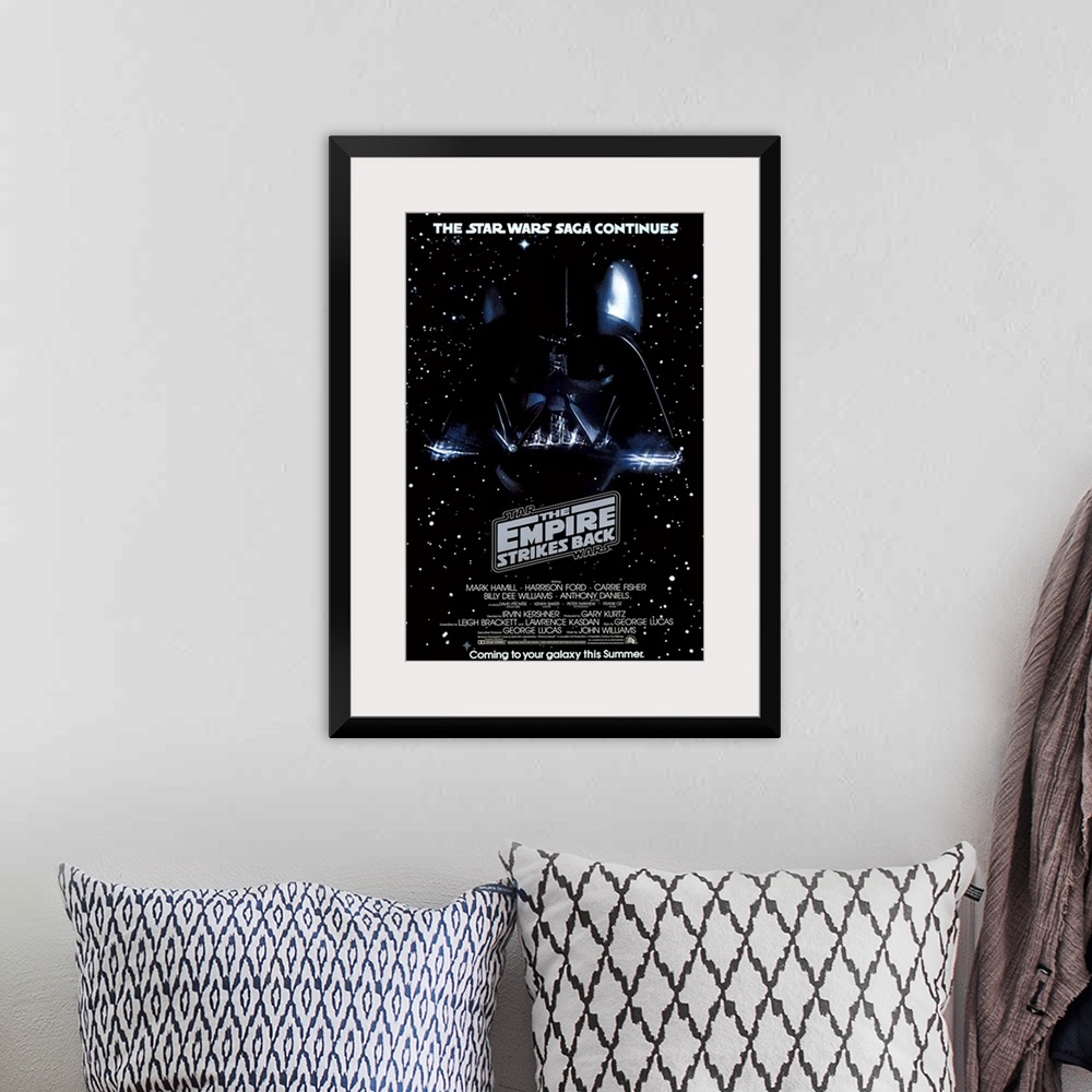 A bohemian room featuring Giant, vertical movie image on canvas for The Empire Strikes Back, with Darth Vader's head on a g...