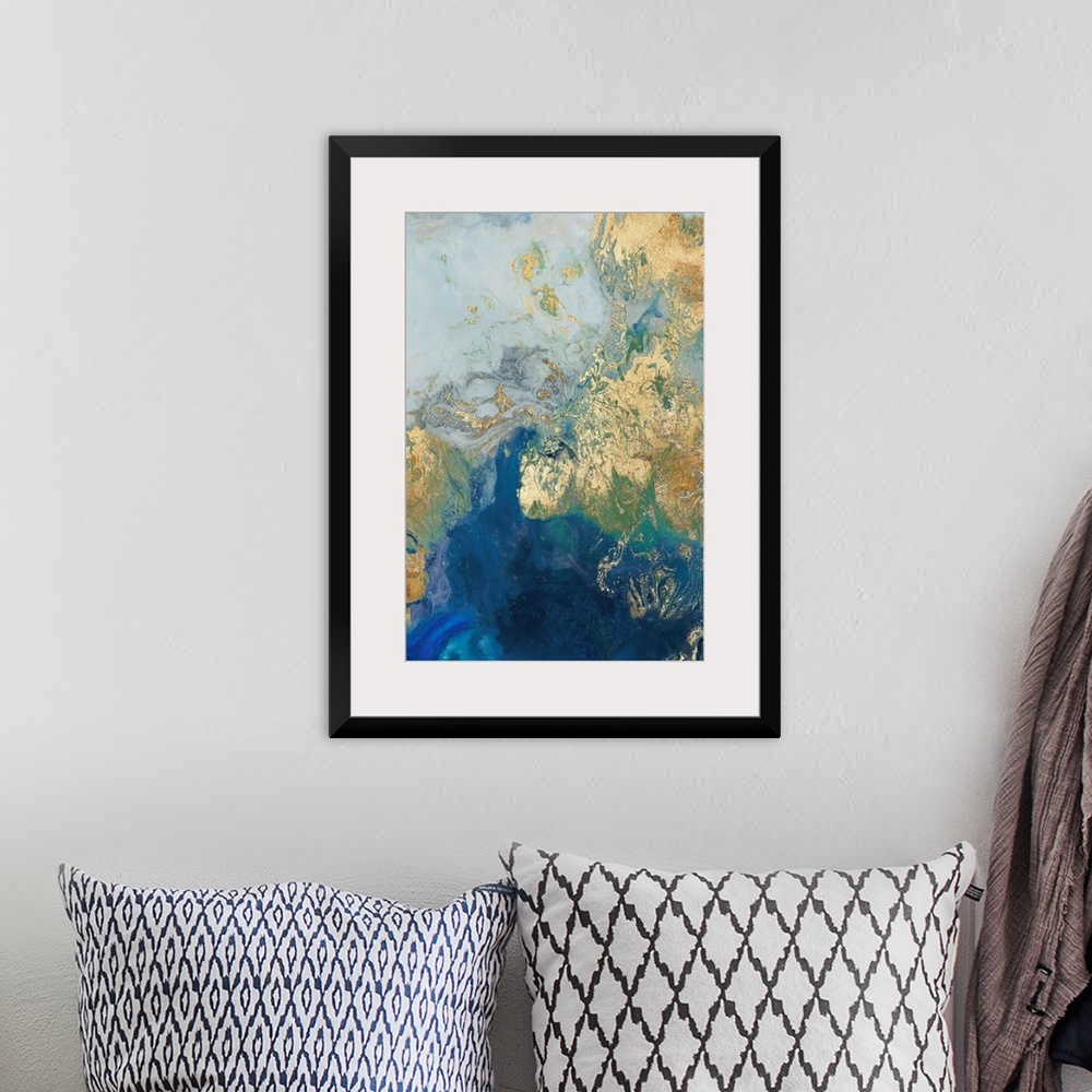 A bohemian room featuring Abstract painting in blue and gold, resembling swirling waves.