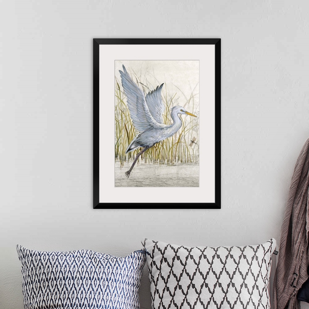 A bohemian room featuring Contemporary artwork of a heron about to take off into flight.