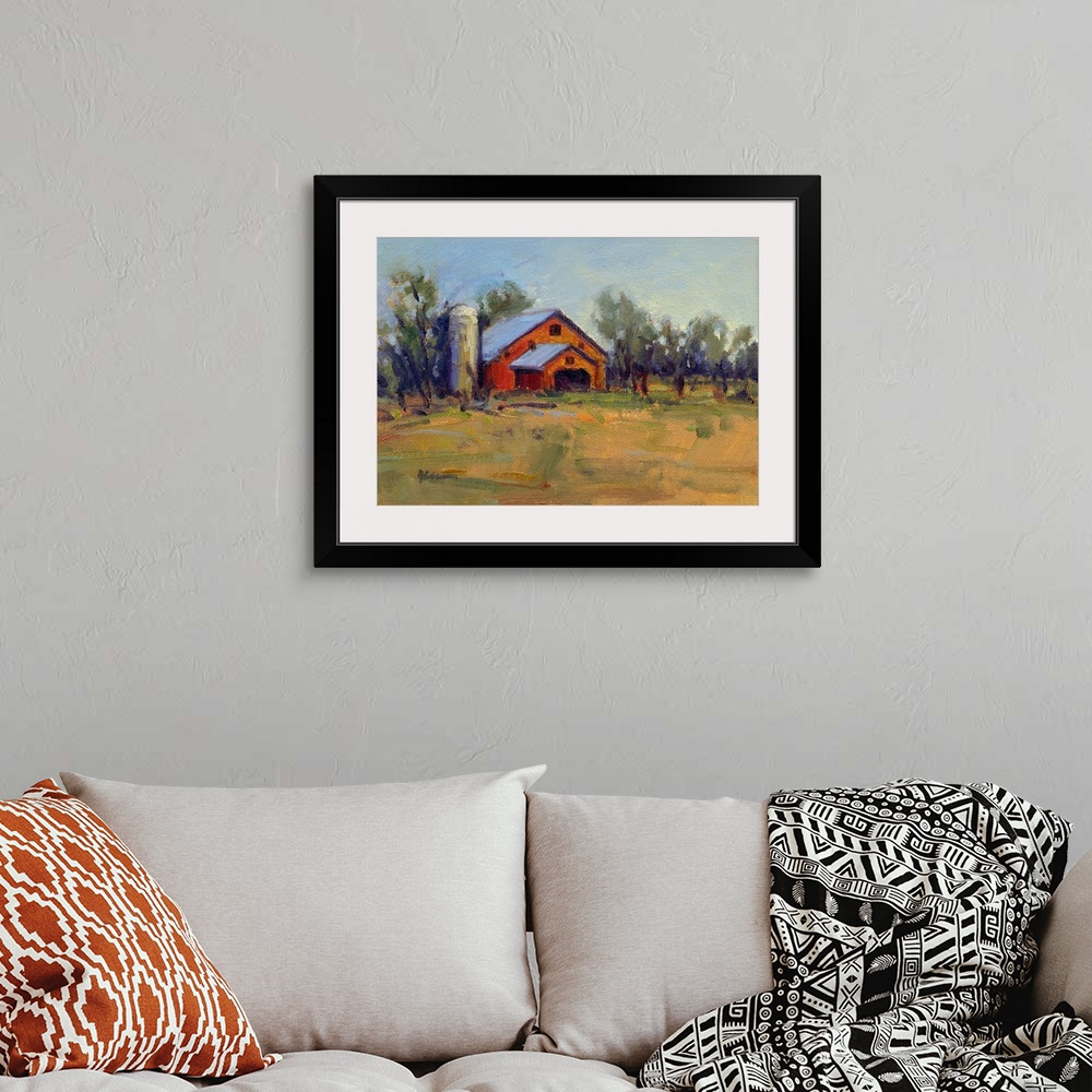 A bohemian room featuring A horizontal contemporary painting of a barn lined with trees in the afternoon light.