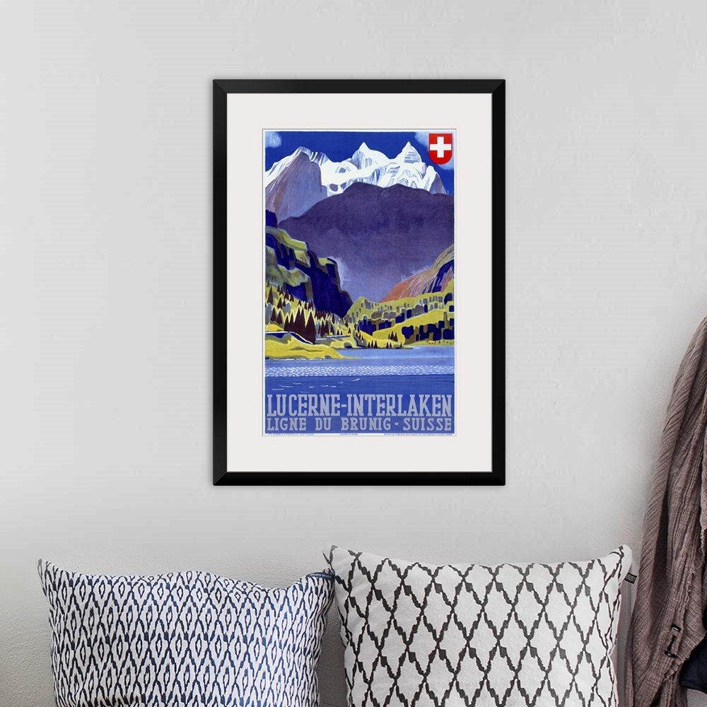 A bohemian room featuring Giant antique art displays a travel advertisement for a destination within the mountains of Switz...