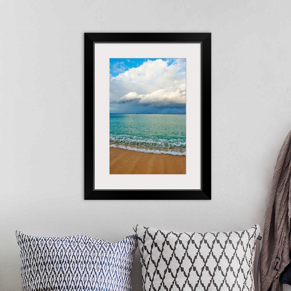 A bohemian room featuring This photograph is taken on a beach in Hawaii of immense clouds that hang in the sky over a teal ...