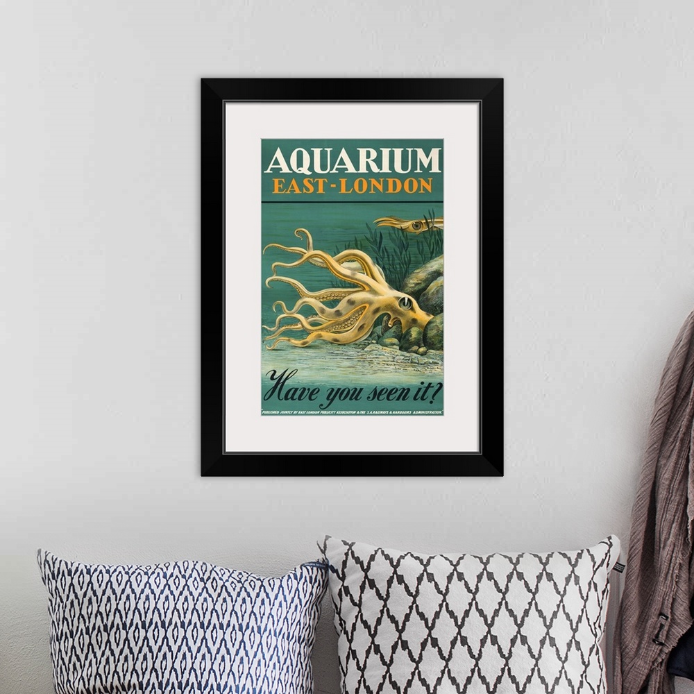 A bohemian room featuring Vintage poster advertisement for Aquarium East London.