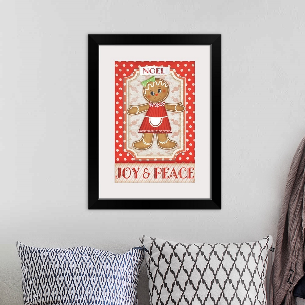 A bohemian room featuring Holiday themed home decor artwork of a gingerbread girl against a red and white polka dotted back...