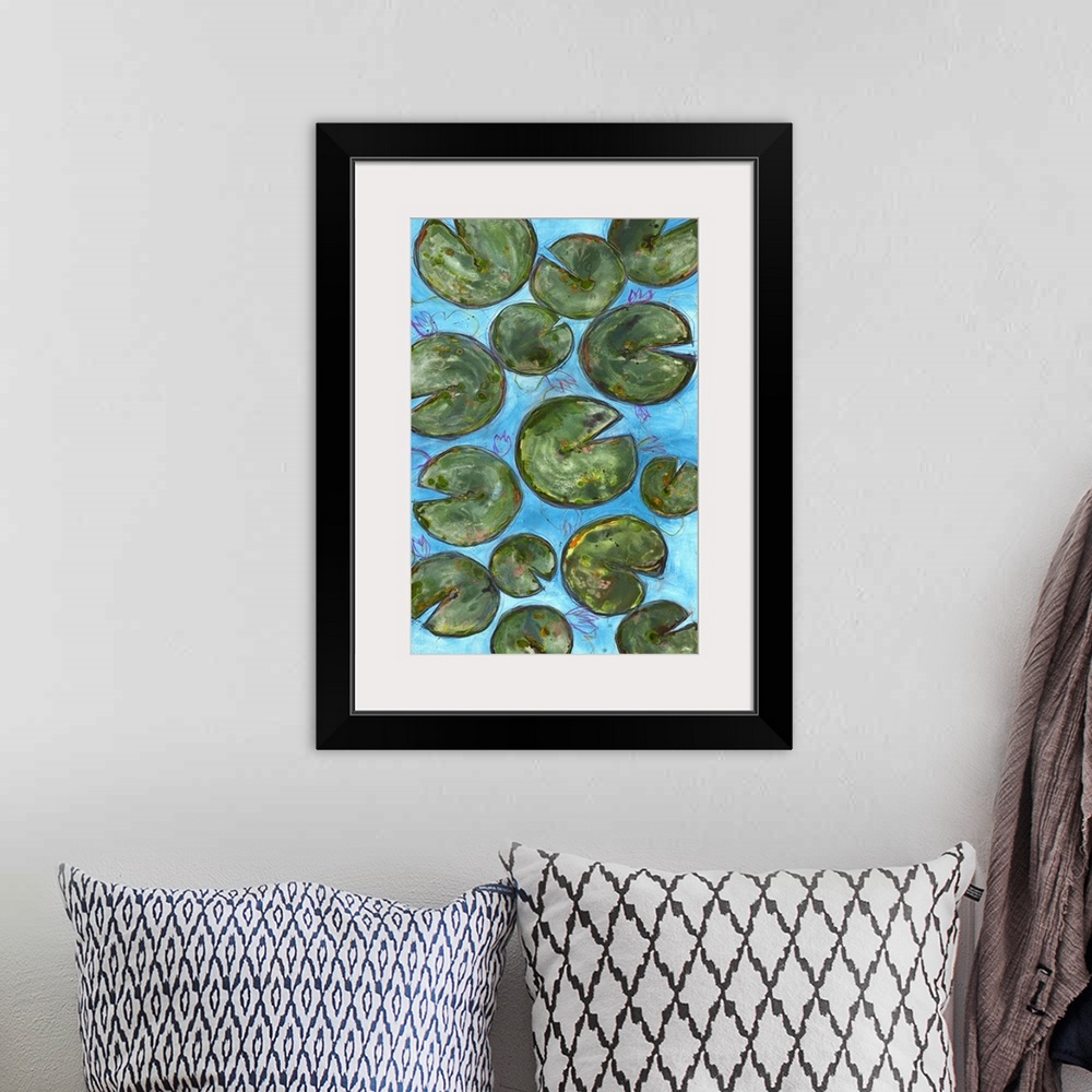 A bohemian room featuring Large painting of lily pads on a blue background with thin pink, purple, orange, and yellow layer...