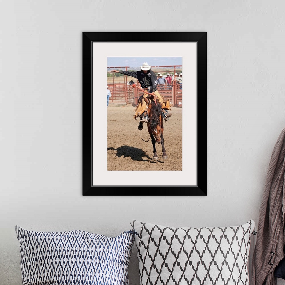 A bohemian room featuring Montana, Crow Agency, Bronco riding during the All Indian Rodeo at the Annual Crow Fair