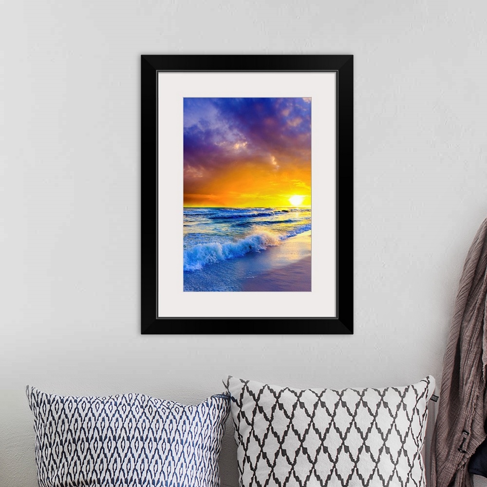 A bohemian room featuring Purple clouds reach out beyond an orange sunset over the ocean. A great sunset to print on canvas.