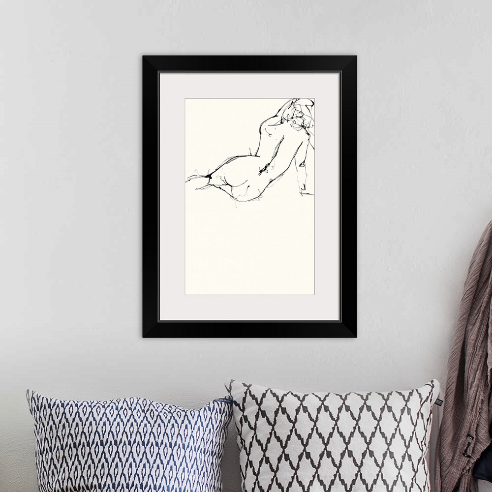 A bohemian room featuring Contemporary nude sketch of the backside of a woman using black ink on an off white background.