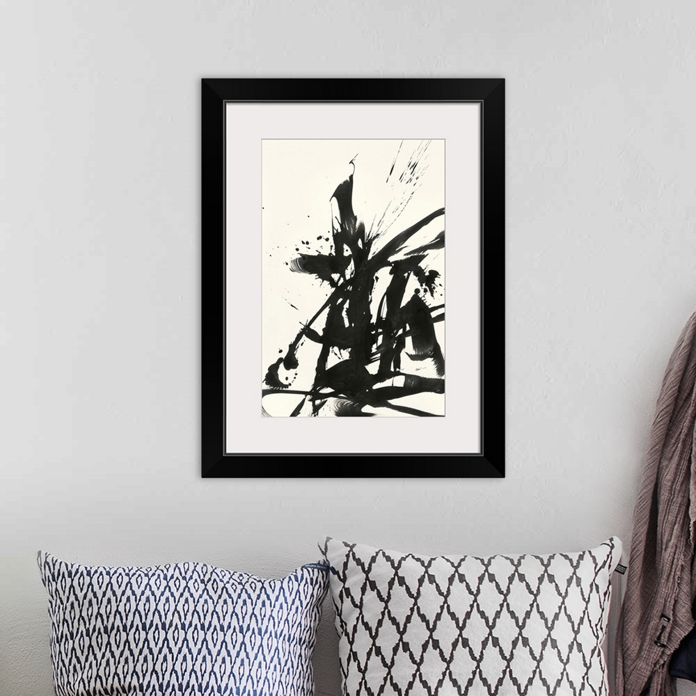 A bohemian room featuring Abstract artwork in black paint on cream.