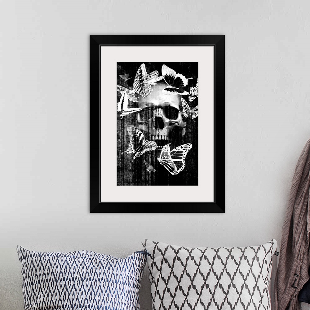 A bohemian room featuring Front view of a fake skull with open mouth isolated on black background.