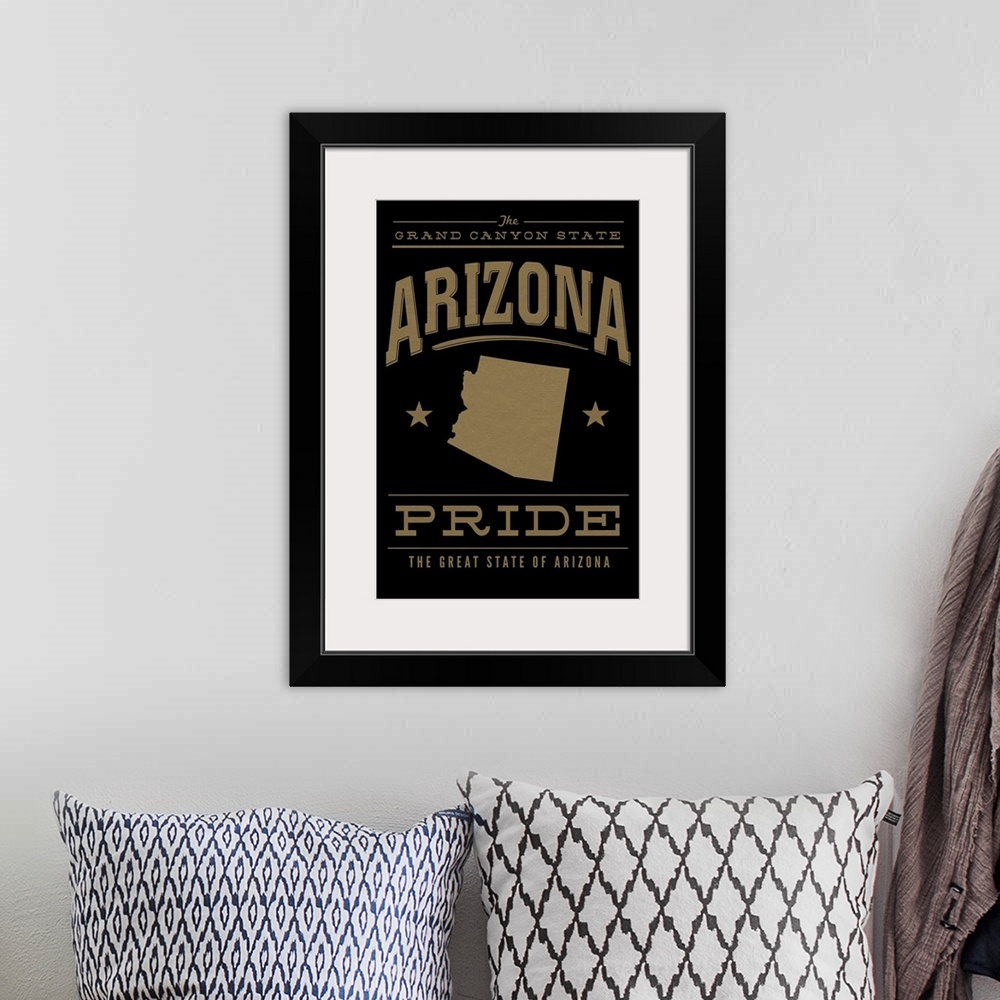 A bohemian room featuring The Arizona state outline on black with gold text.