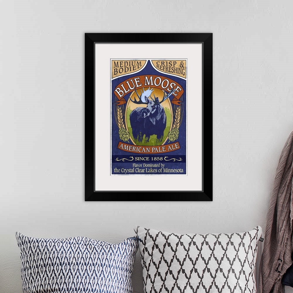 A bohemian room featuring Retro stylized art poster of a vintage sign using a moose to advertise ale.