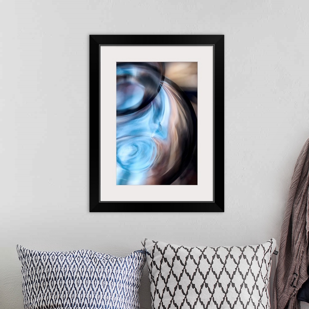 A bohemian room featuring Tall abstract photo on canvas of the up close of a vase.
