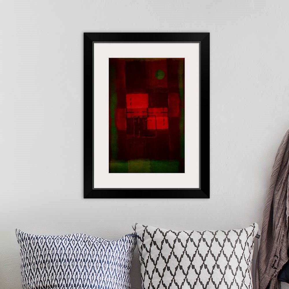 A bohemian room featuring Geometric abstract artwork that consists of shades of red and green in polygonal shapes.