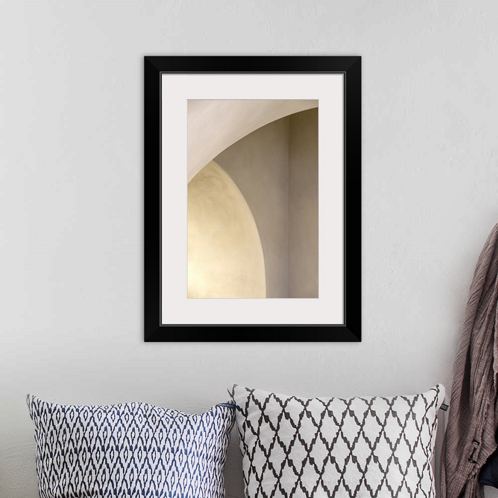 A bohemian room featuring Abstract photo of curved arches with white light.