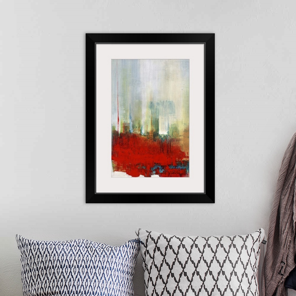A bohemian room featuring Contemporary abstract artwork in bright red with hazy blue and green.