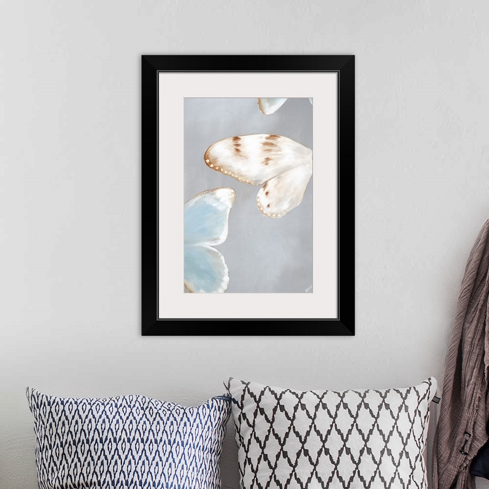 A bohemian room featuring Contemporary abstract painting of pale colored butterflies against a gray background.