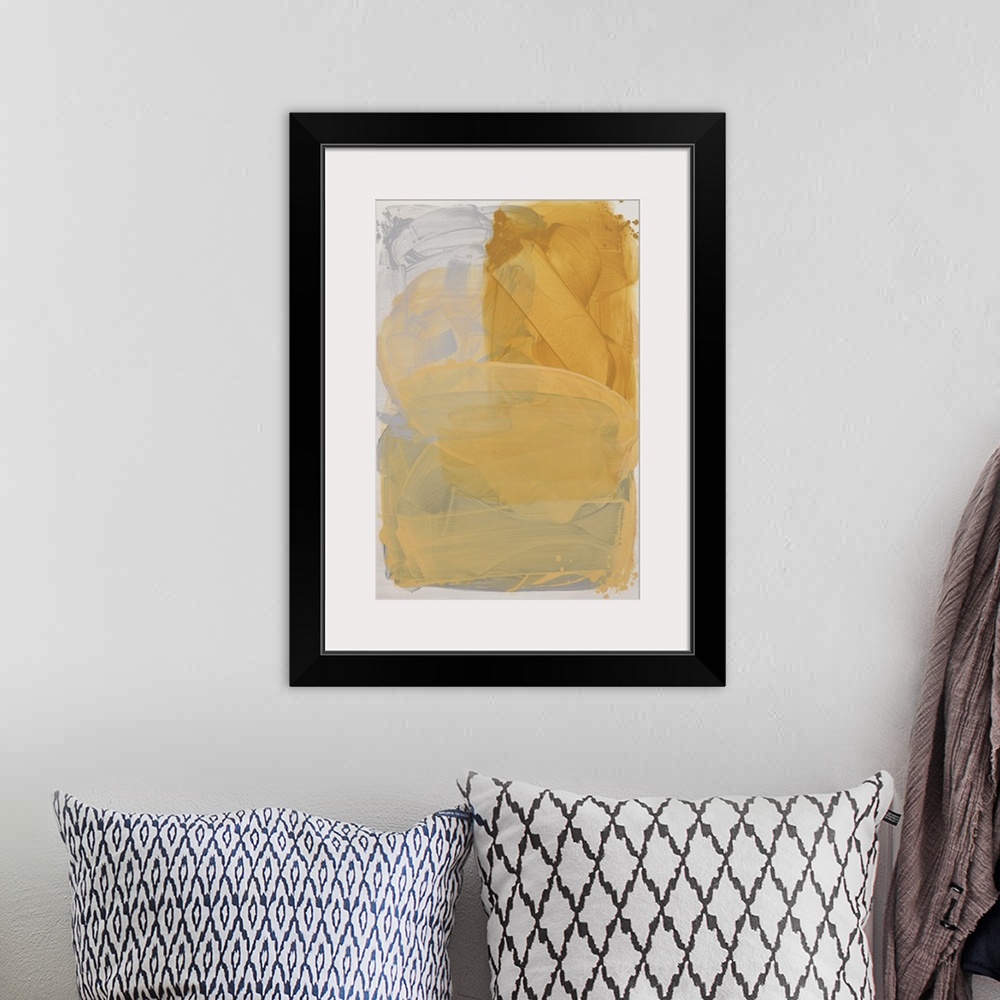 A bohemian room featuring Yellow abstract artwork in a series of three primary color paintings.