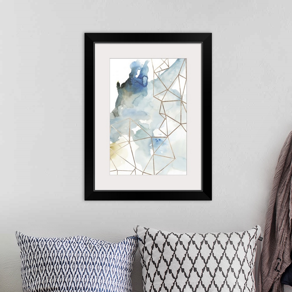 A bohemian room featuring Abstract watercolor painting of blue and brown with geometric gold lines.