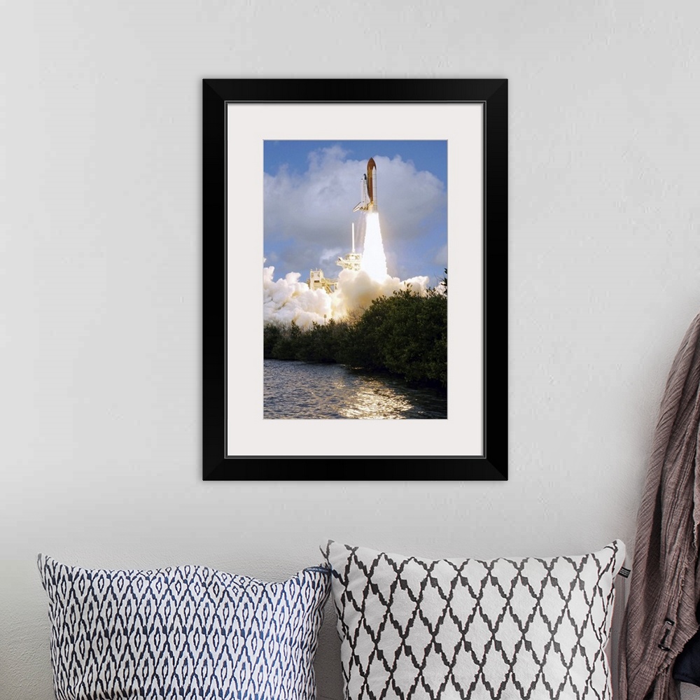 A bohemian room featuring Space Shuttle Discovery launch