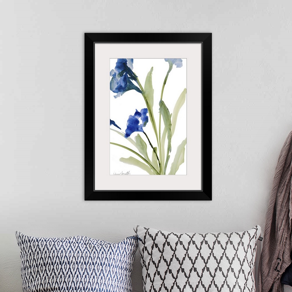 A bohemian room featuring Watercolor painting of blue flowers on green stems against a white background.