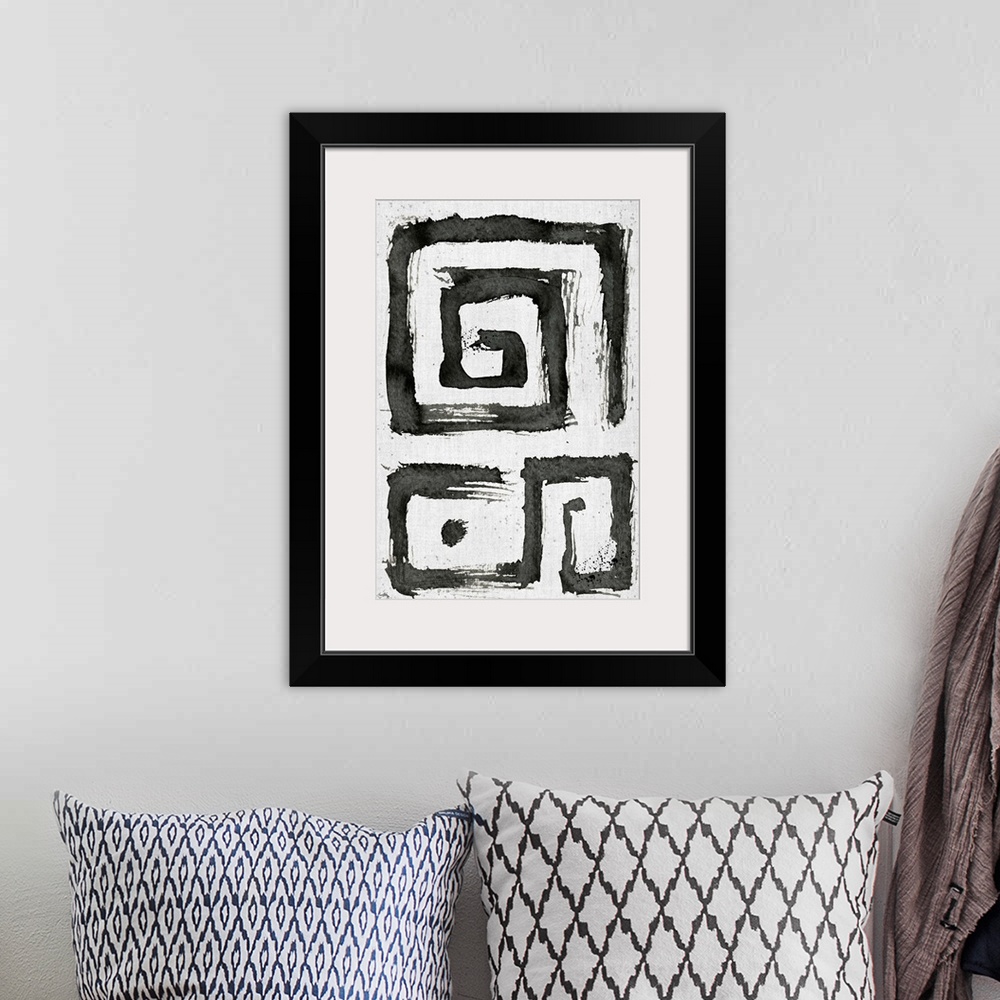 A bohemian room featuring Black and white abstract painting of boxy tribal swirls.