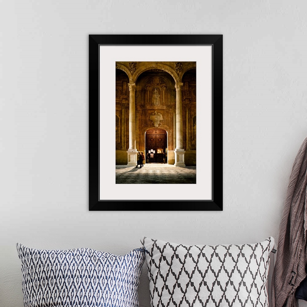A bohemian room featuring Some people at the entrance of the Santo Domingo Church in Granada, Spain