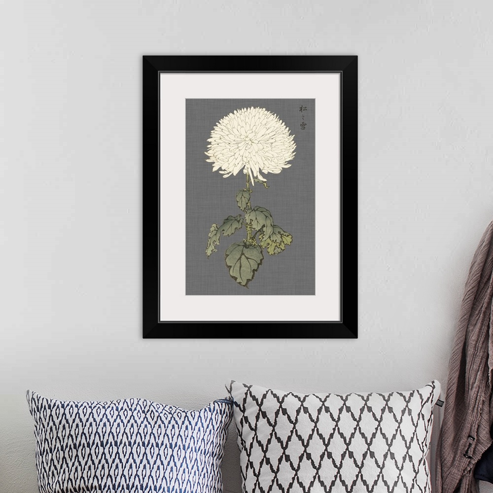 A bohemian room featuring Decorative art with a large ivory mum on a gray textured background.