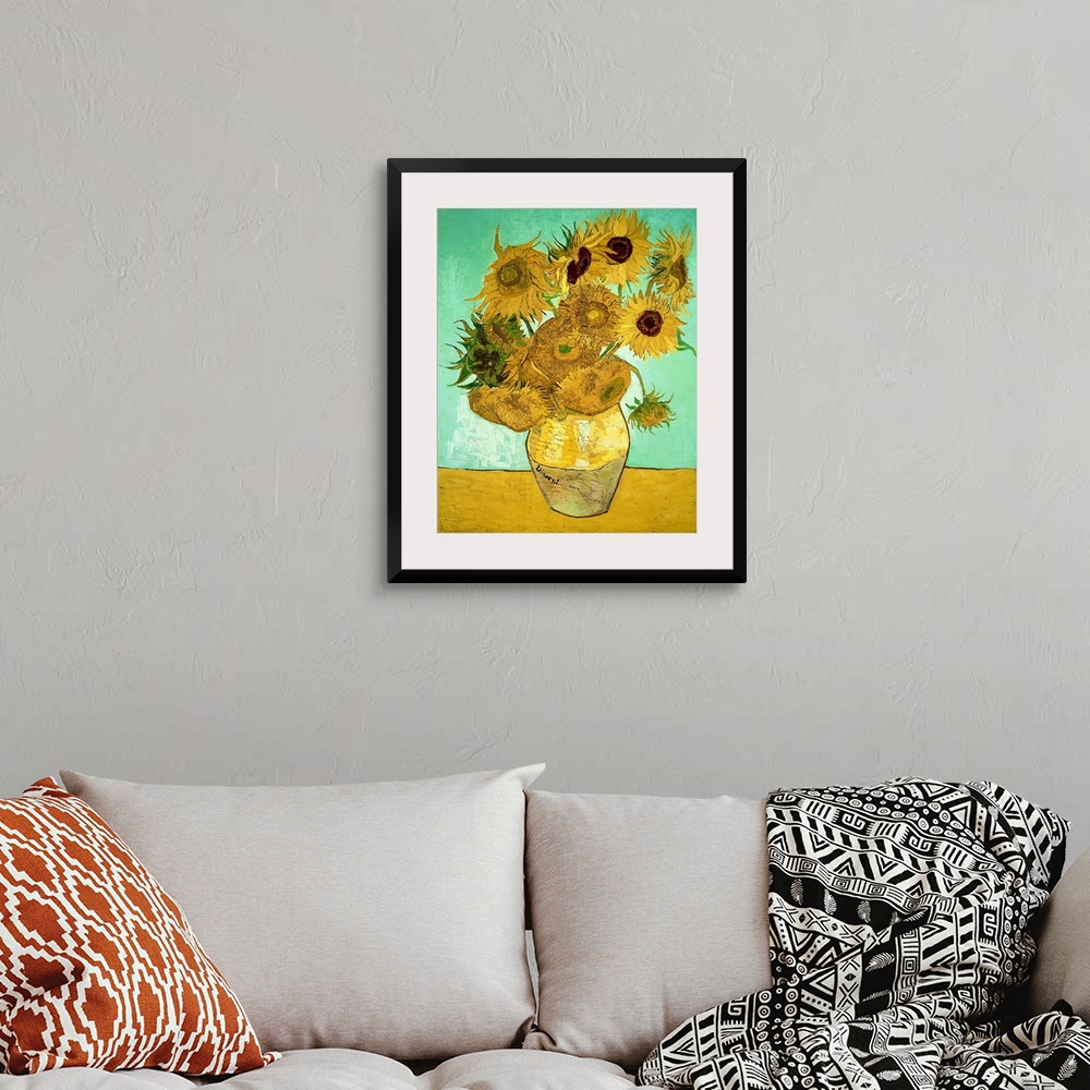 A bohemian room featuring Classic oil painting of warm colored sunflowers in a vase with a cool toned background.