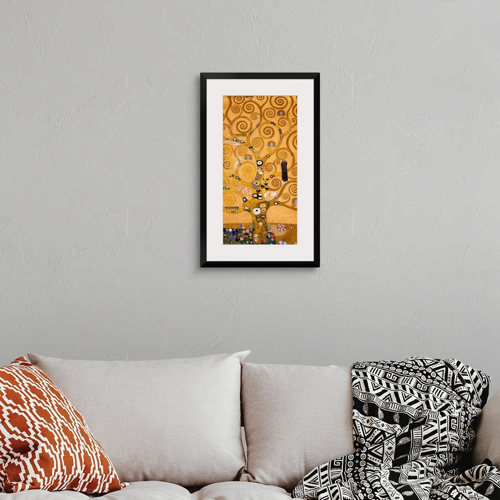 A bohemian room featuring Modern painting of a large, golden tree with all its branches in spiral shapes, and patchwork-lik...