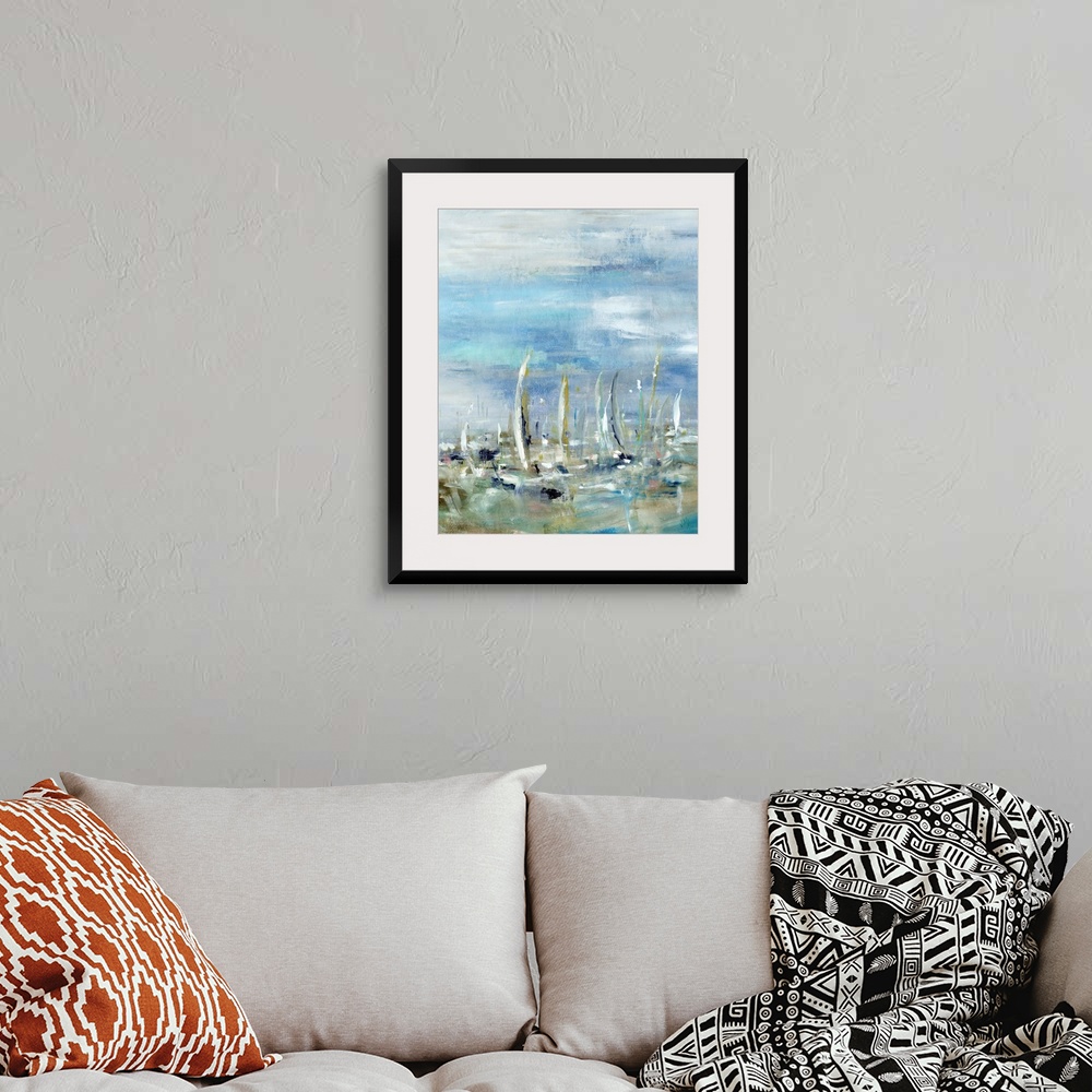 A bohemian room featuring Abstract painting of sailboats in the ocean on a cloudy day.  The boat shapes are created from va...