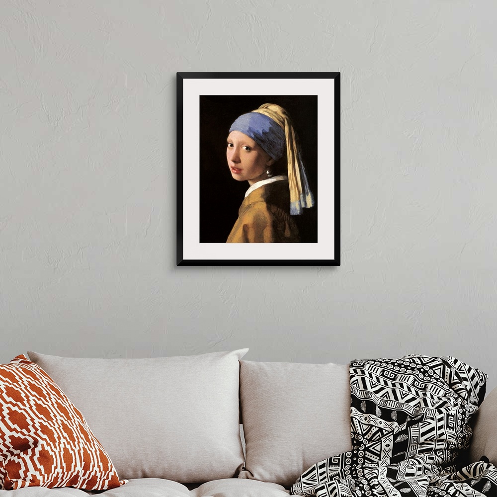 A bohemian room featuring Classic artwork of a girl that has her head slightly turned to the side so you can only see the l...